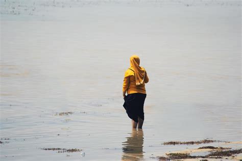 Sorong, Indonesia 2021- People on the beach 3340296 Stock Photo at Vecteezy