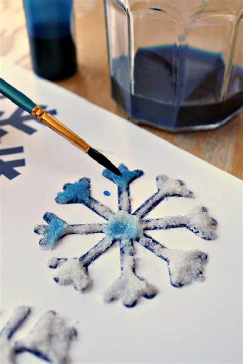 Salt, glue and watercolor painting to make snowflake art - NurtureStore