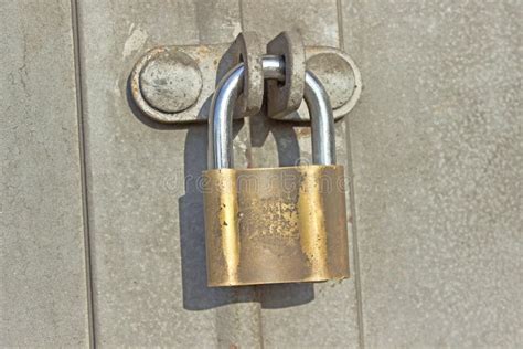 Padlock on metal door stock photo. Image of protection - 34373156