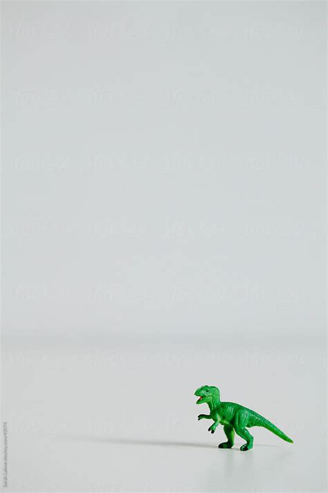 "Mini Green Toy Dinosaur." by Stocksy Contributor "Sarah Lalone" - Stocksy