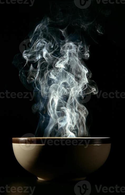 Picture of smoke rising from the food above the cup The concept of hot ...