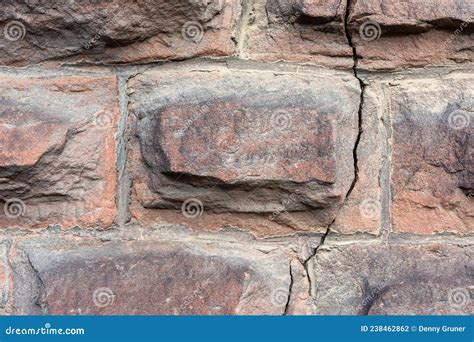 A brick wall with a crack stock photo. Image of material - 238462862