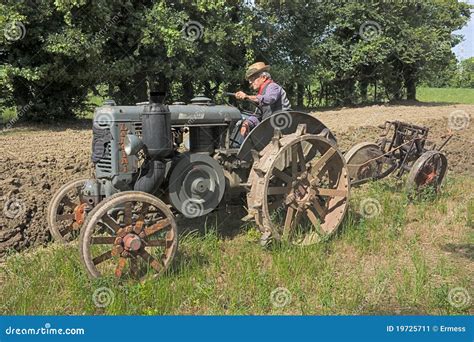 Plowing with old tractor editorial photo. Image of crop - 19725711