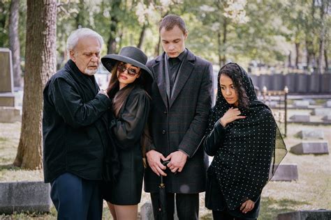 A Grieving Family at a Cemetery · Free Stock Photo