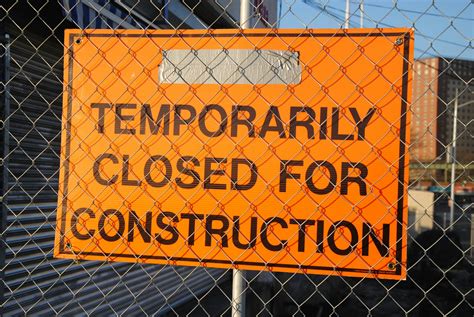 Orange and Black Temporarily Closed for Construction Signage · Free Stock Photo