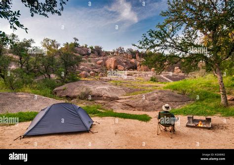 Camper at campsite in Enchanted Rock State Natural Area in Hill Country near Fredericksburg ...