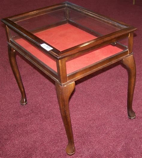 Handsome small glass & wood display table