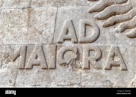 The latin sentence “Ad maiora” set in stone in capital letters, means literally to greater ...