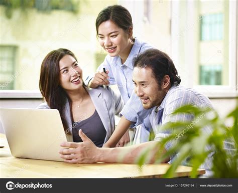 Asian business people working together in office — Stock Photo © imtmphoto #157240184