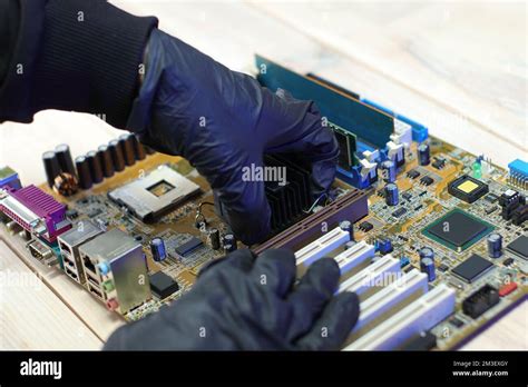 replacement of the chipset cooling system from the computer motherboard on the table Stock Photo ...