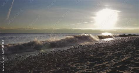 4K LAKEFRONT SUNRISE. Filmed in 4K at 24 frames per second. Beach sunrise with waves. Stock ビデオ ...