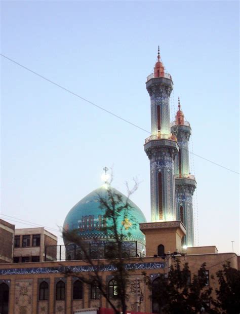 a tall building with a blue dome on top