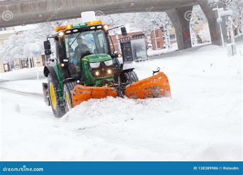 Tractor plowing snow editorial photo. Image of sodertalje - 138389986