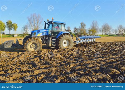 Tractor plowing the field stock image. Image of plowing - 27832381