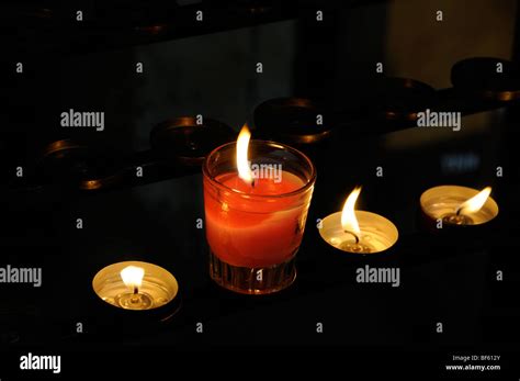 Church Candles burning Stock Photo - Alamy