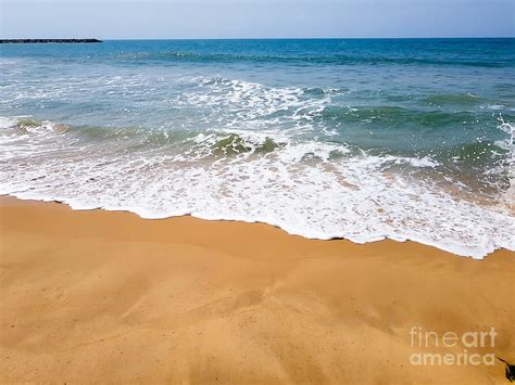 Waves and sea foam on the beach Photograph by Effi - - Fine Art America