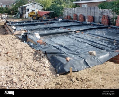 Black plastic polythene oversite damp proof membrane to floor slab Stock Photo: 893580 - Alamy