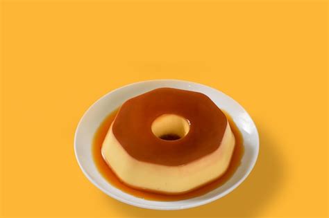 Premium Photo | A plate of flan with caramel sauce on it