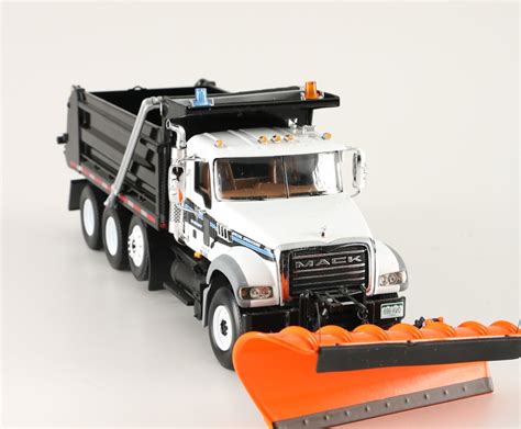 Pair of Die-Cast Dump Trucks with Snow Plows | EBTH