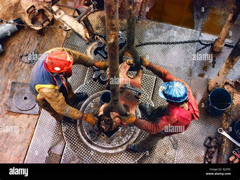 High view looking down on roughneck workers on oil rig, New Mexico, USA Stock Photo - Alamy