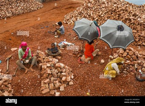 Children in Dhaka's slums play. Often these children are frequently stunted and malnourished and ...