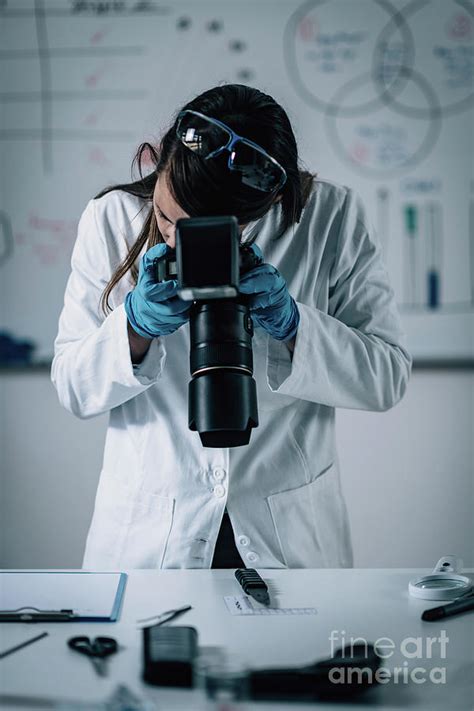 Forensics Expert Examining Crime Scene Evidence Photograph by Microgen ...