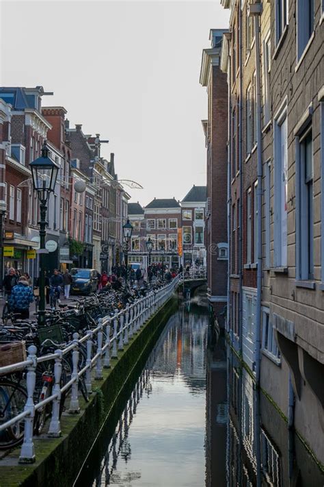 City Center of Delft, Netherlands with the Traditional Canals and Bikes Editorial Image - Image ...