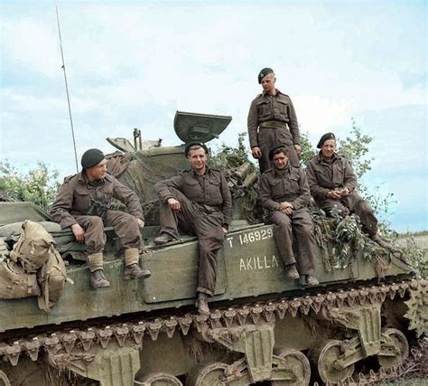 A Brit sherman crew during pose on their tank during the Battle of Normandy, summer of 1944 ...