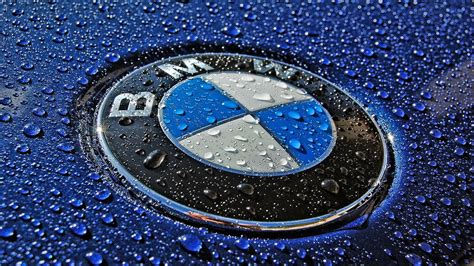 Stunning HD Wallpaper of a BMW Logo with Raindrops