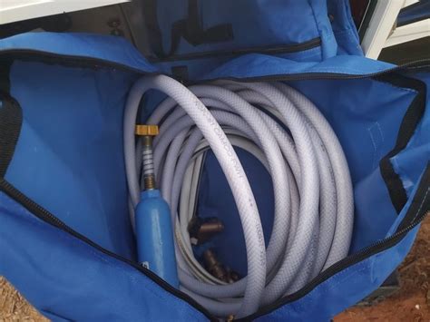 Rv water hose storage idea. | Hose storage, Water hose, Waste tanks