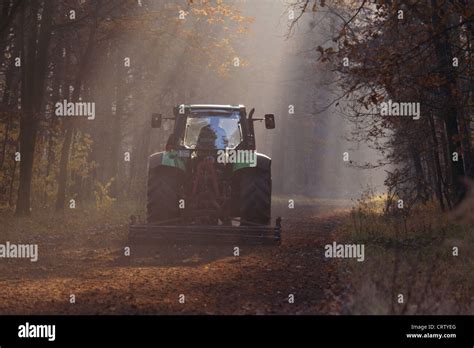 A tractor with harrow Stock Photo - Alamy