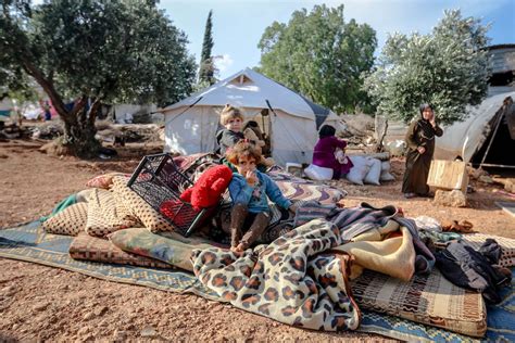 Children sitting in refugee camp · Free Stock Photo