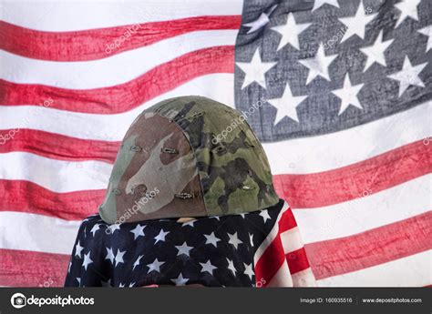 Old Army Helmet And Flag Stock Photo by ©fotoskat 160935516