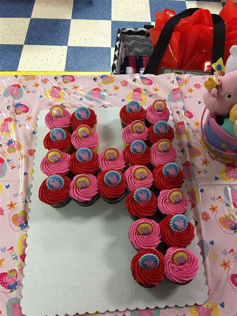 Peppa Pig number 4 cupcake cake with Peppa Pig rings on top. Number ...