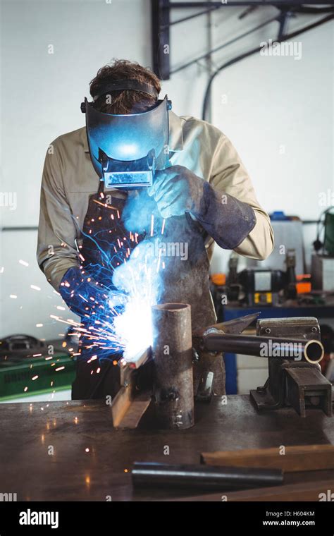 Welder welding a metal Stock Photo - Alamy