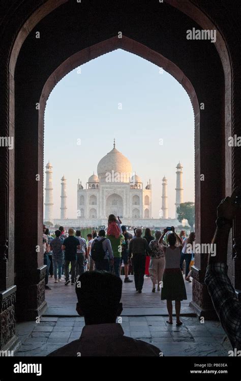 Entrance gate to Taj Mahal with tourists Stock Photo - Alamy