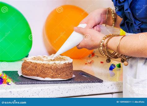 Woman Decorating Birthday Cake with Culinary Syringe Stock Image - Image of food, female: 109940011