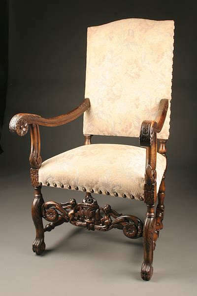 French Louis XIII baroque chair with detailed carvings.