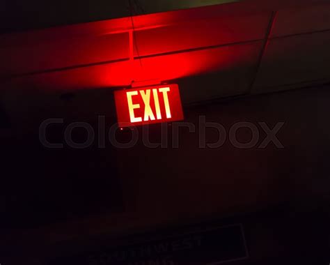 Illuminated red exit sign. Red light ... | Stock image | Colourbox