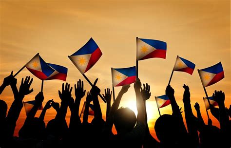 Group of People Waving Filipino Flags in Back Lit | free image by ...