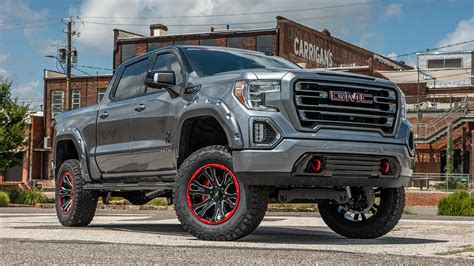 GMC BLACK WIDOW LIFTED TRUCKS — SCA Performance | Black Widow Lifted Trucks