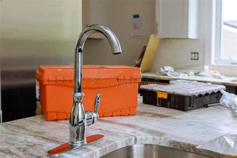 Plumber Prepared To Installing Water Tap on Sink Kitchen New Home Stock Image - Image of ...