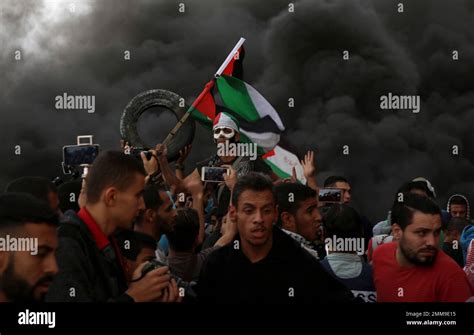 Protesters chant slogans while waves their national flags as others ...