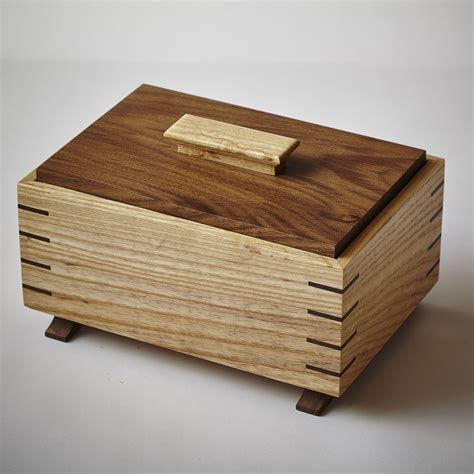 Grain-wrapped ash and walnut keepsake box with splined-miter joints, inset lid, and arched feet ...