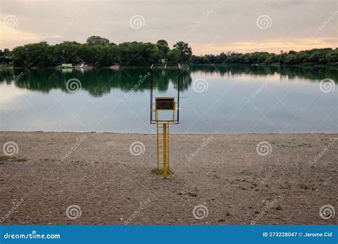 Panorama of Bela Crkva Lakes at Dusk with Calm Water and Sunny Sky and a Water Rescue Seat. Also ...