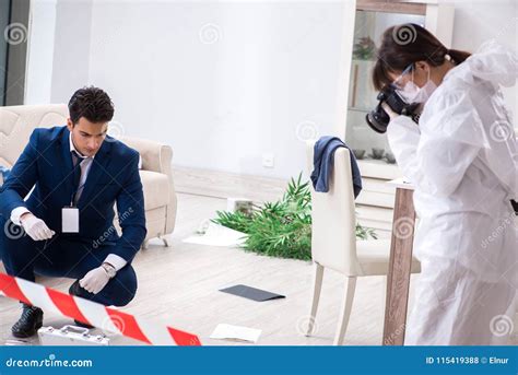 The Forensics Investigator at the Scene of Office Crime Stock Photo ...