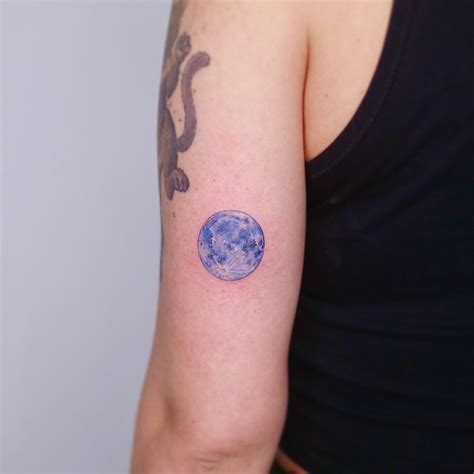 A blue full moon tattoo by tattooist Nemo - Tattoogrid.net