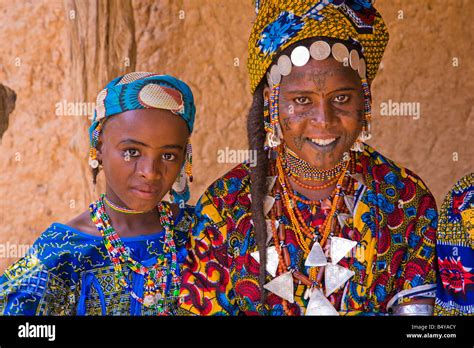 Two girls in southwestern Niger dress up in their finest clothing and ...