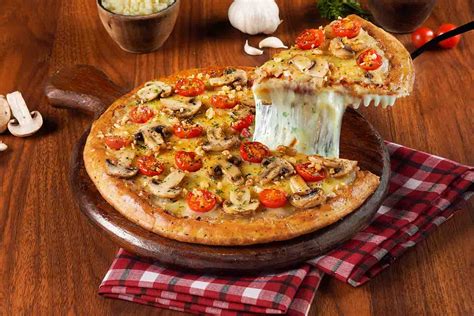 Order Roasted Garlic And Mushroom Cheese Burst Pizza Medium online from ...