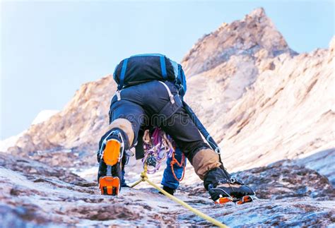 Climber Reaches the Summit of Mountain Peak. Climbing and Mountaineering Sport Concept Stock ...